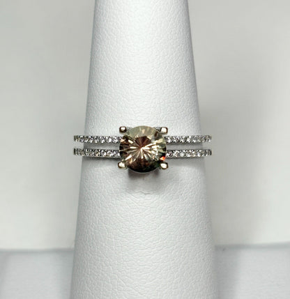 A bicolor Oregon sunstone ring with diamonds in 18k white gold.