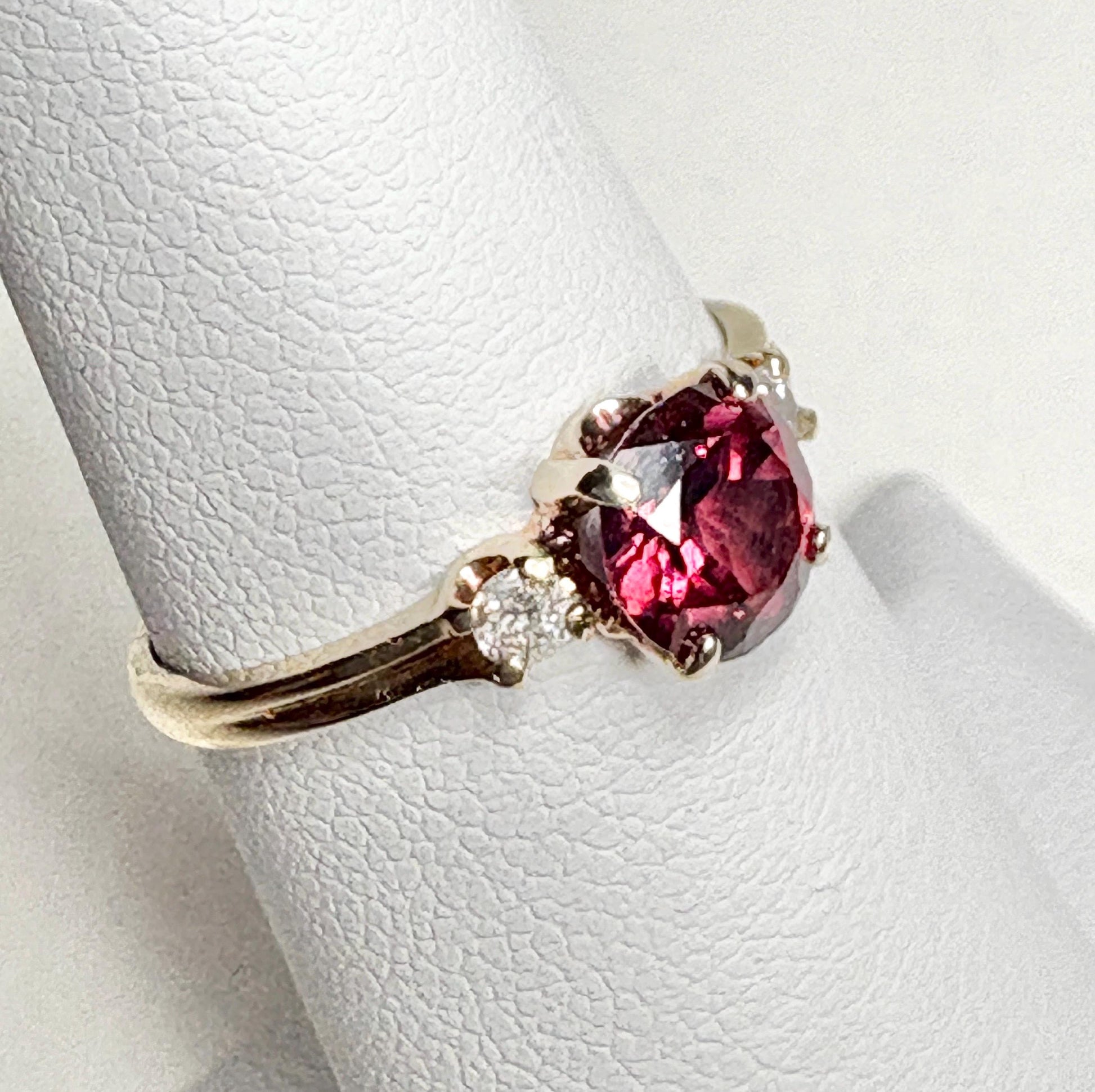 Vintage 10k gold ring with a merlot garnet and two diamonds.