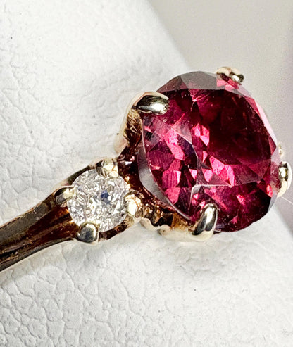 Vintage 10k gold ring with a merlot garnet and two small diamonds.