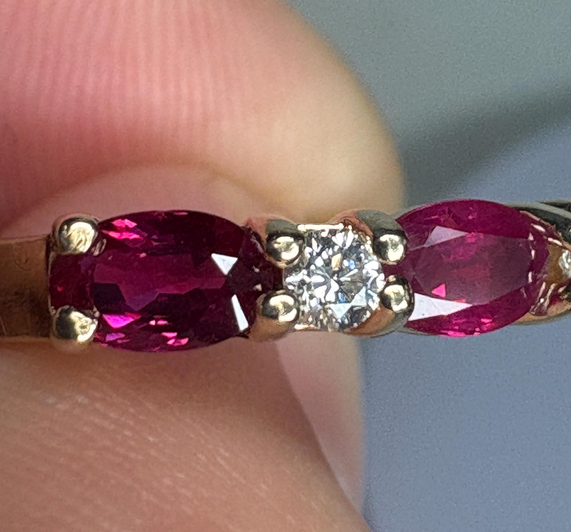 14k gold band ring with oval rubies and diamonds.