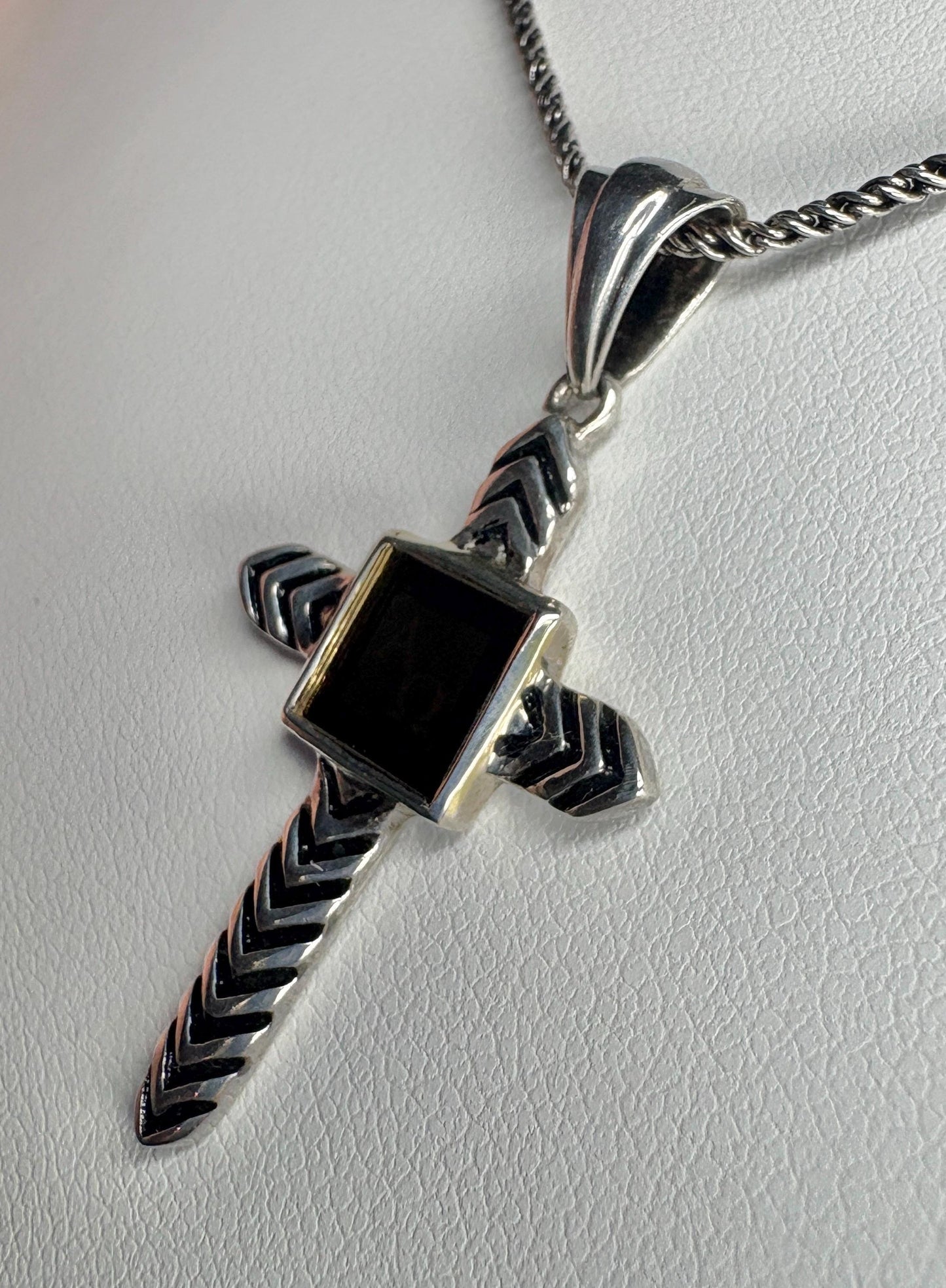 Sterling silver cross pendant necklace with a black inlay and a laser-inscribed Bible.