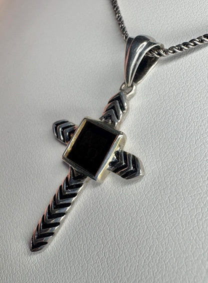 Sterling silver cross pendant necklace with a black inlay and a laser-inscribed Bible.