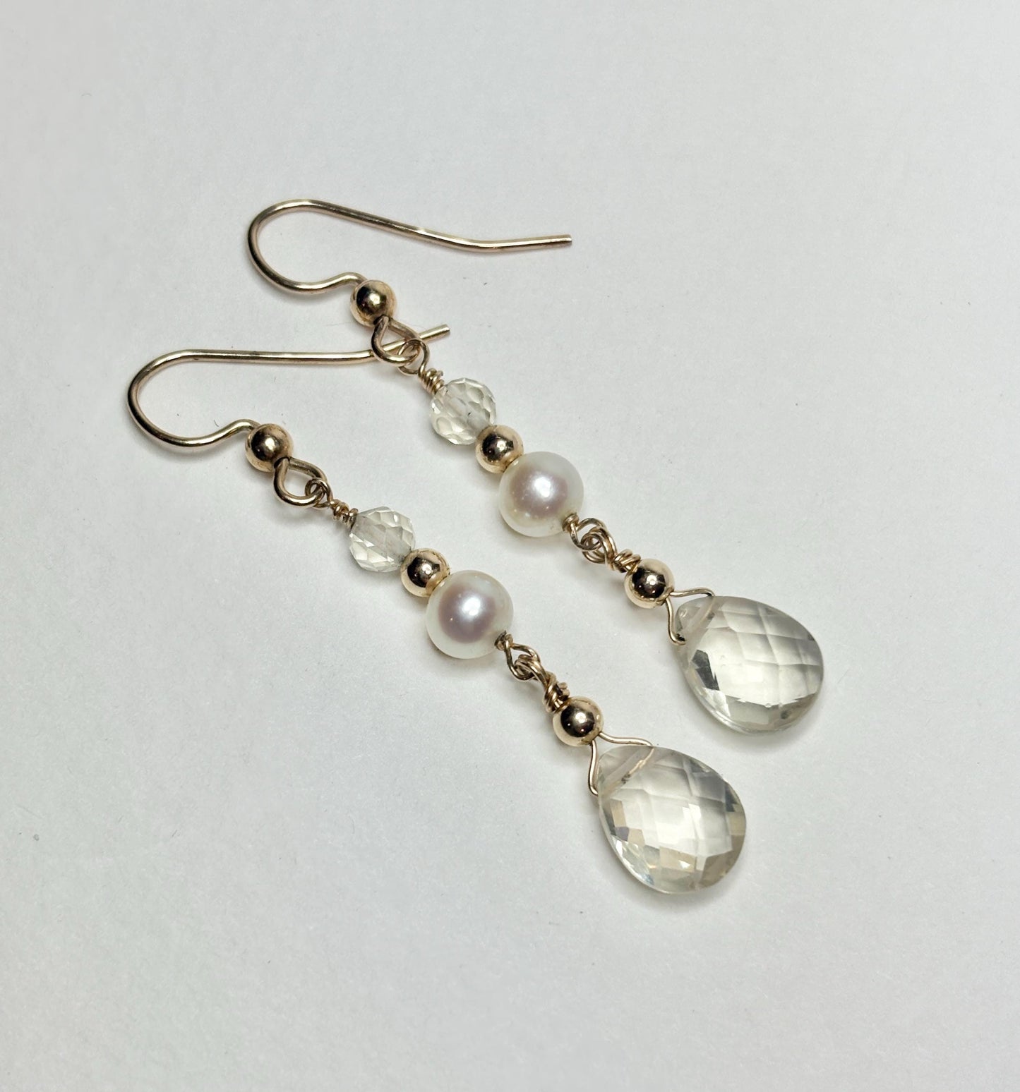 Gold filled dangle earrings with Oregon sunstone, cultured pearls, and faceted clear beads.