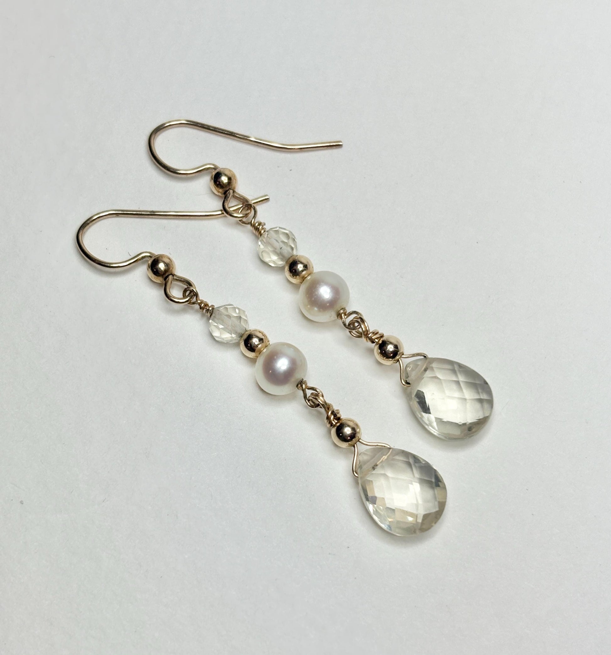 Gold filled dangle earrings with Oregon sunstone, cultured pearls, and faceted clear beads.