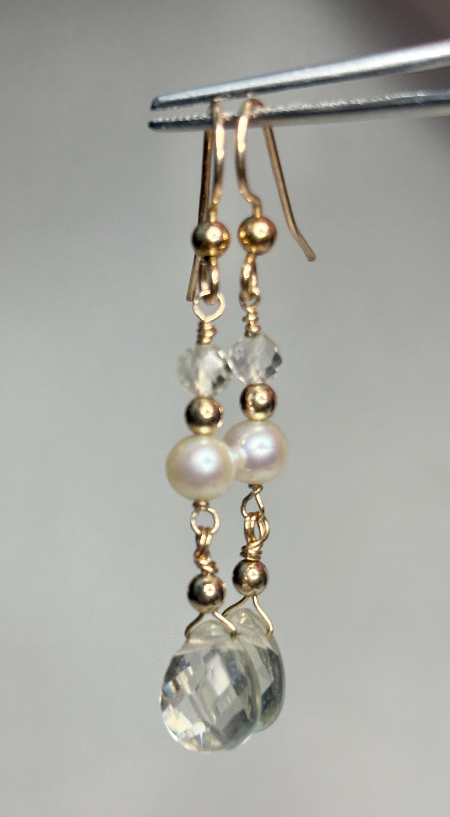 Gold filled dangle earrings with pearls, faceted crystals, and gold beads.