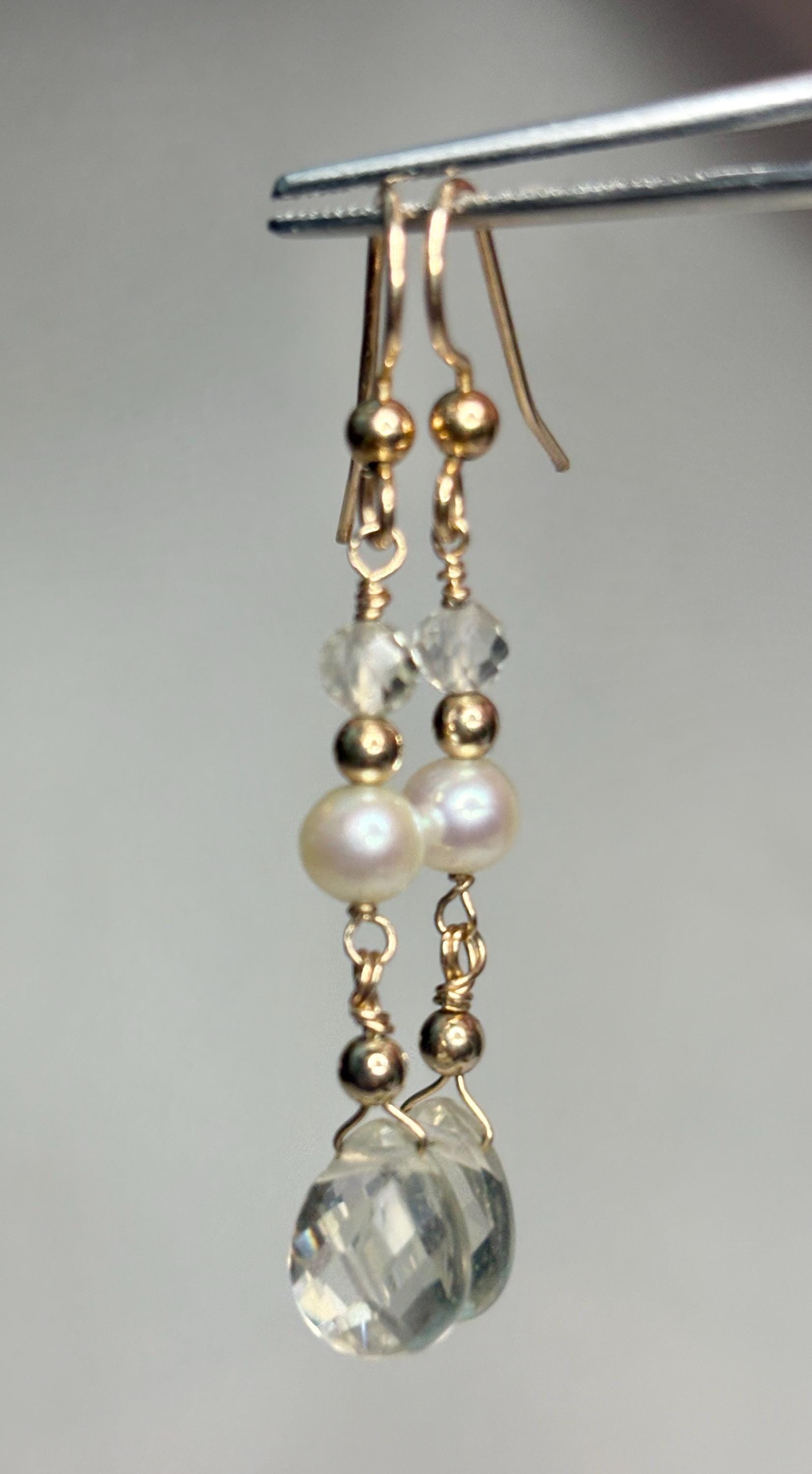 Gold filled dangle earrings with pearls, faceted crystals, and gold beads.