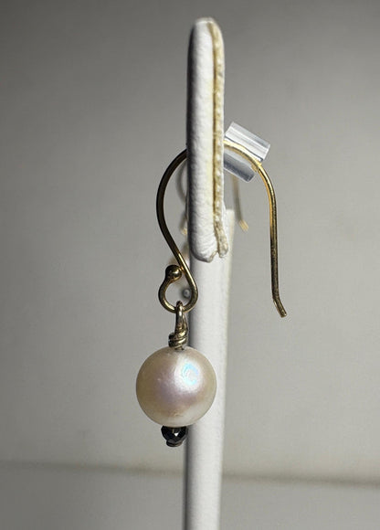14k gold dangle earrings with a 6mm Akoya pearl and a 2mm faceted black diamond bead.