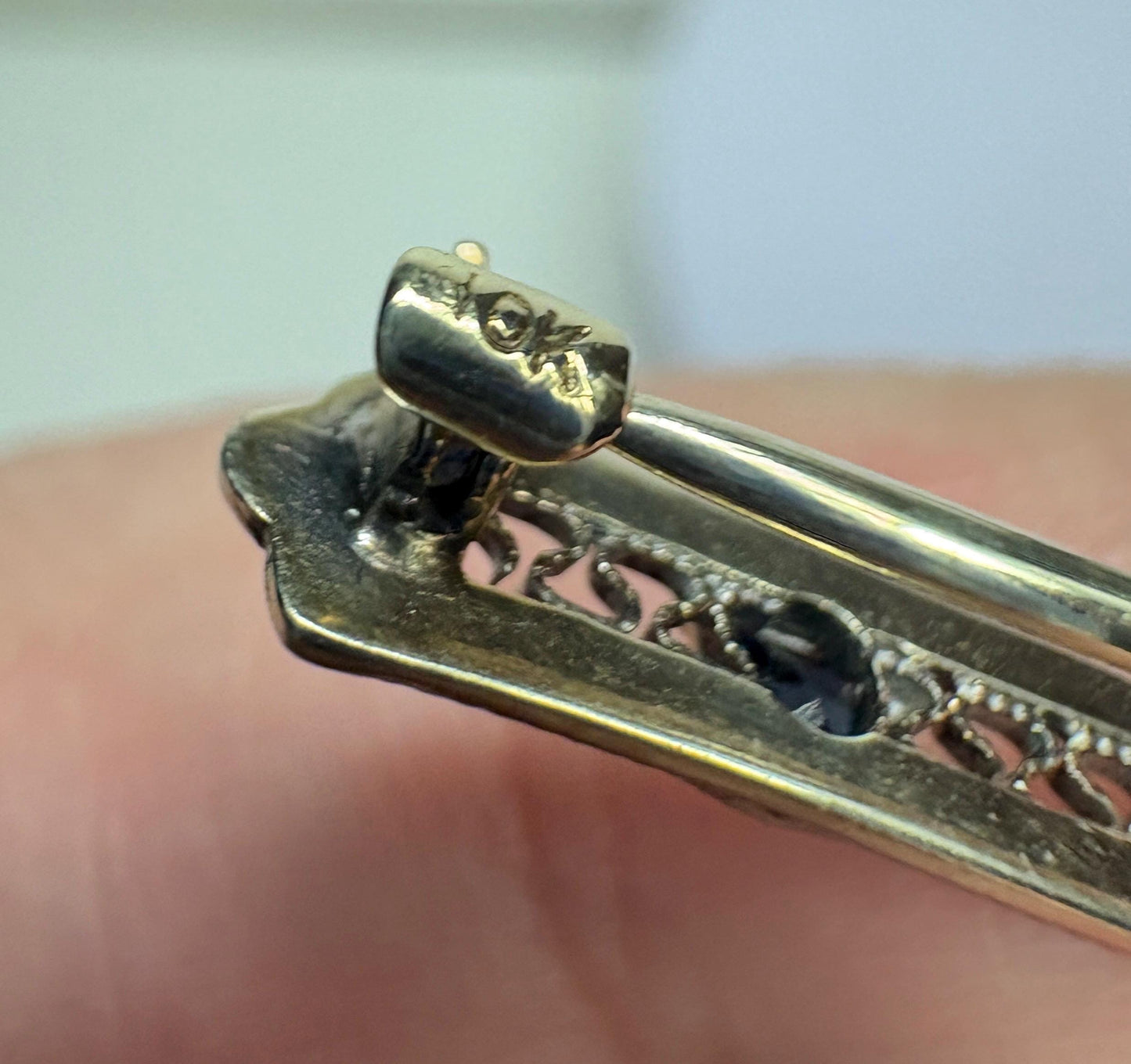 Antique 10k white gold bar brooch with an old mine cut diamond and simulated sapphires.