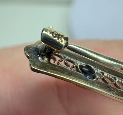 Antique 10k white gold bar brooch with an old mine cut diamond and simulated sapphires.