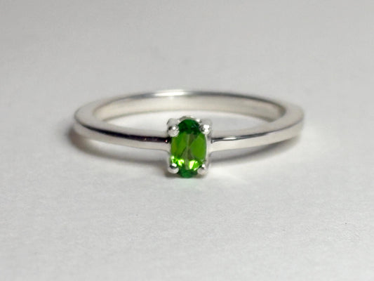 Sterling silver ring with a 3x5mm oval chrome diopside solitaire.