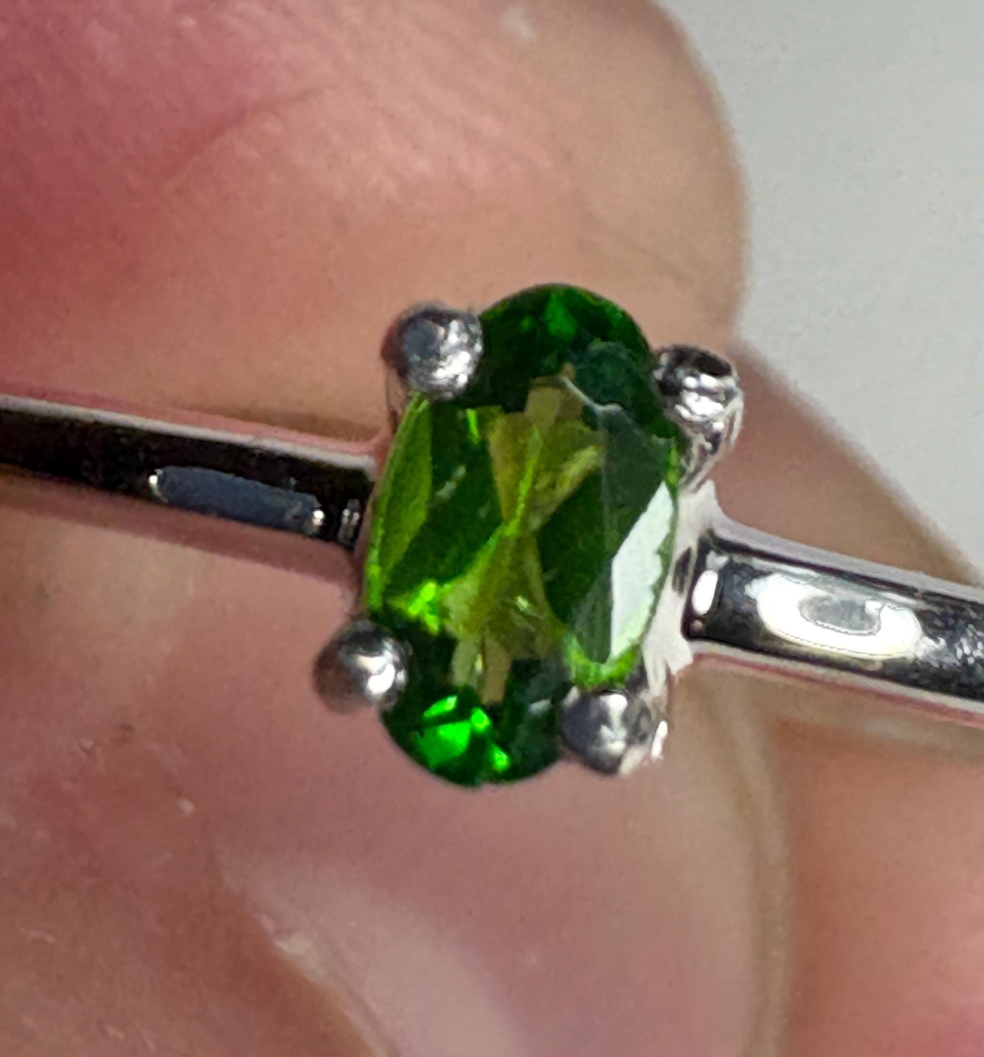 Sterling silver ring with a 3x5mm oval chrome diopside solitaire.
