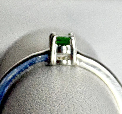 Sterling silver ring with a small oval chrome diopside gemstone.