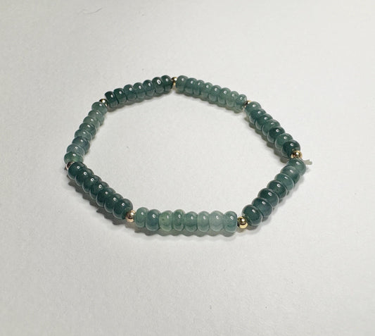 Guatemalan Type A jadeite jade stretch bracelet with gold beads.