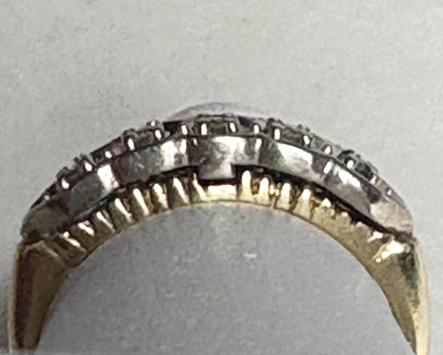 Vintage two-toned 10k gold band ring with small diamonds.
