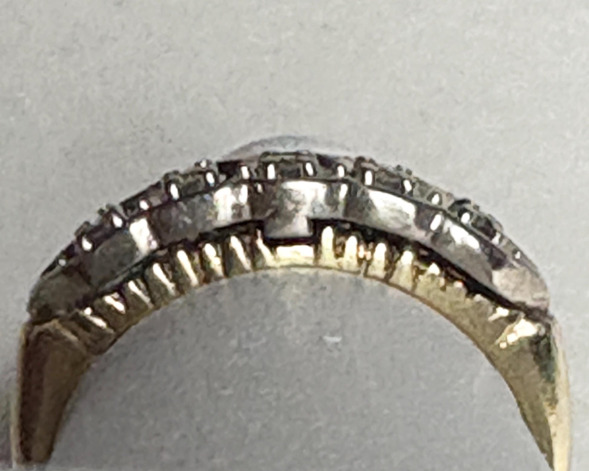 Vintage two-toned 10k gold band ring with small diamonds.