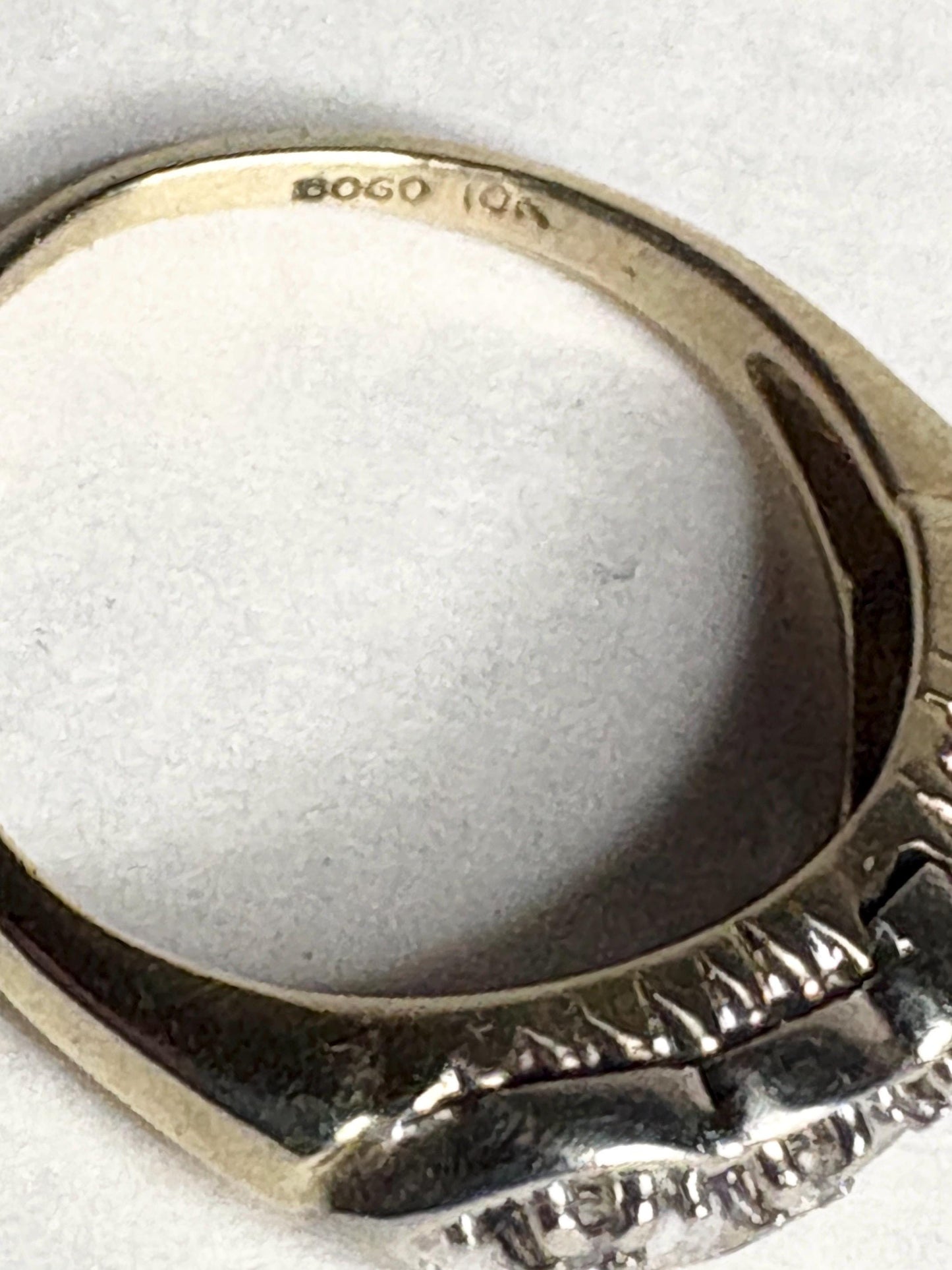 Vintage two-toned 10k gold band ring with small diamonds and "BOGO 10k" stamp.
