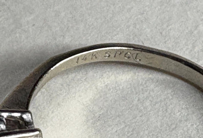 14k white gold ring with "14k SPCL" inscription.