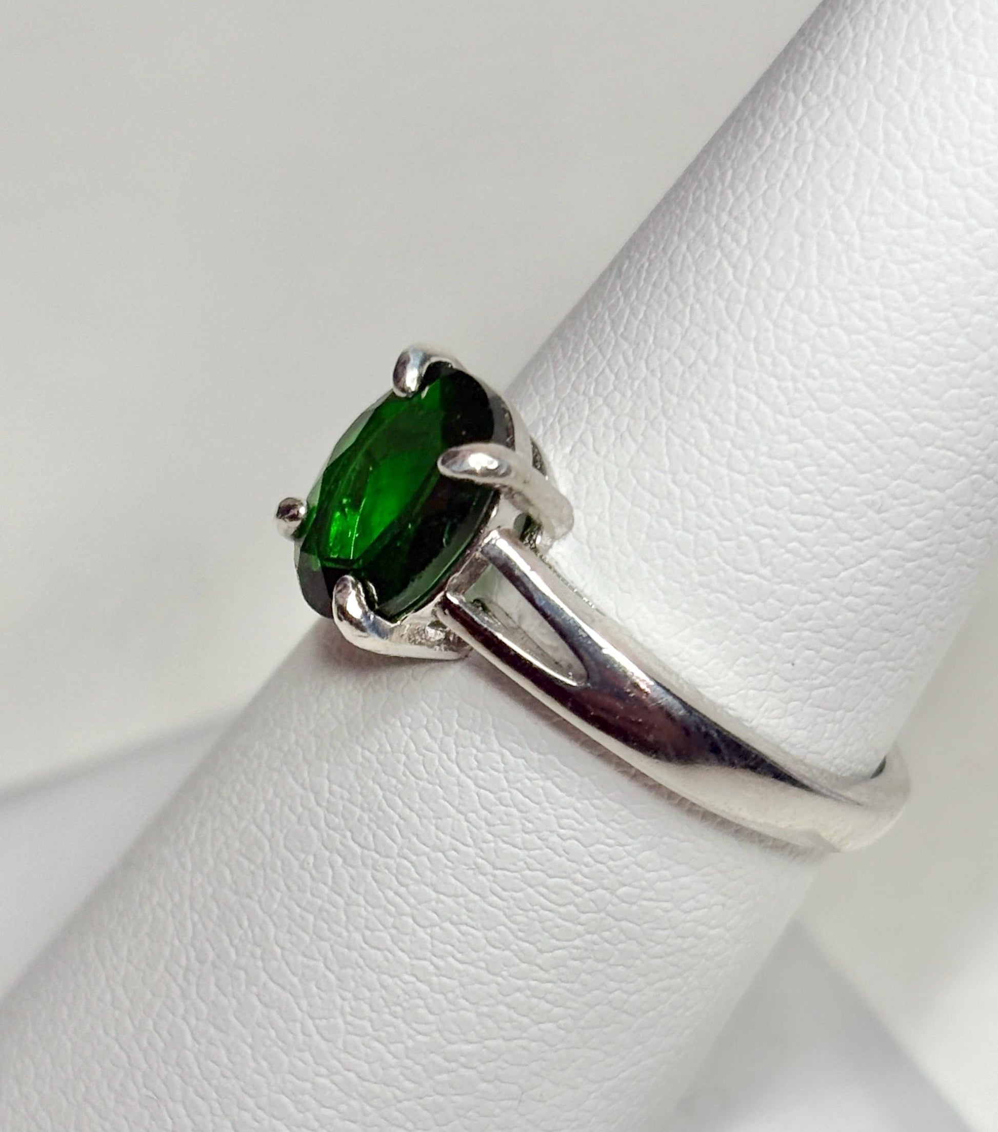 Sterling silver ring with a natural oval chrome diopside gemstone.