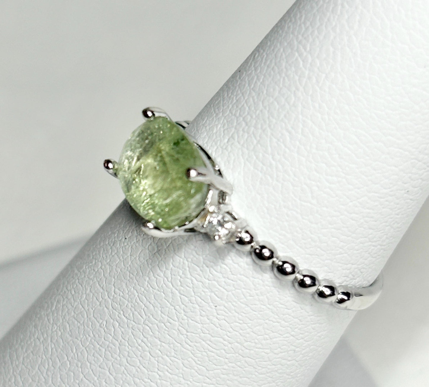 Sterling silver ring with a green tourmaline and diamonds.