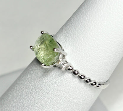 Sterling silver ring with a green tourmaline and diamonds.