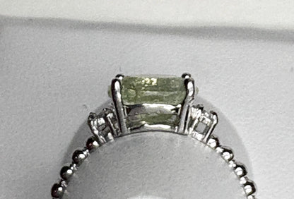 Sterling silver ring with a green tourmaline and diamonds.