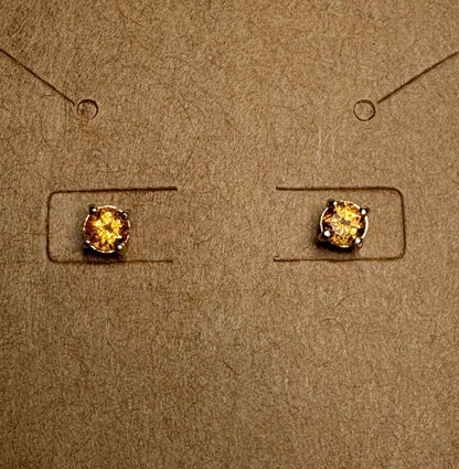 Spessartite garnet stud earrings in solid 9k gold.