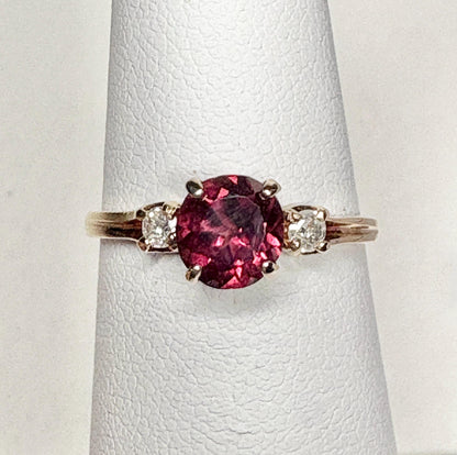 Vintage 10k gold ring with a merlot garnet and two diamonds.