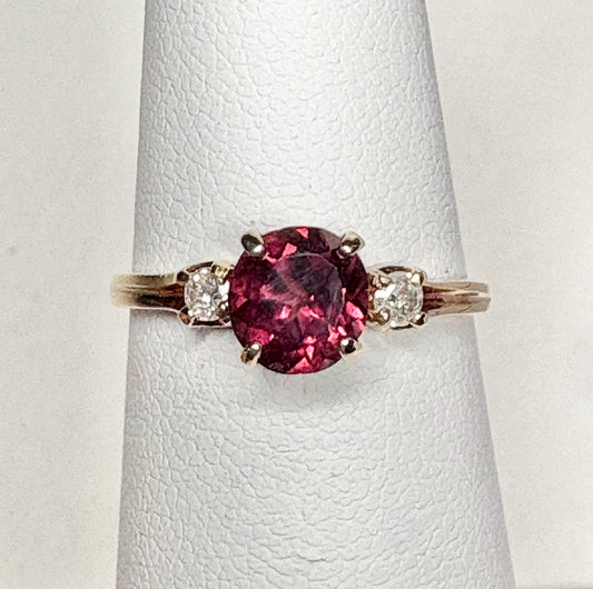 Vintage 10k gold ring with a merlot garnet and two diamonds.