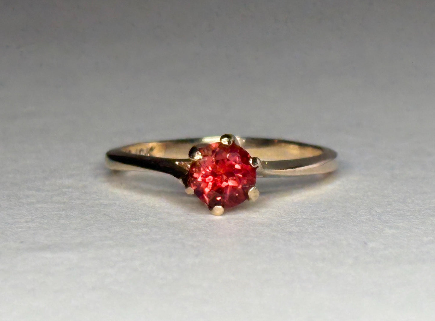 Red Oregon sunstone solitaire ring in 10k gold.