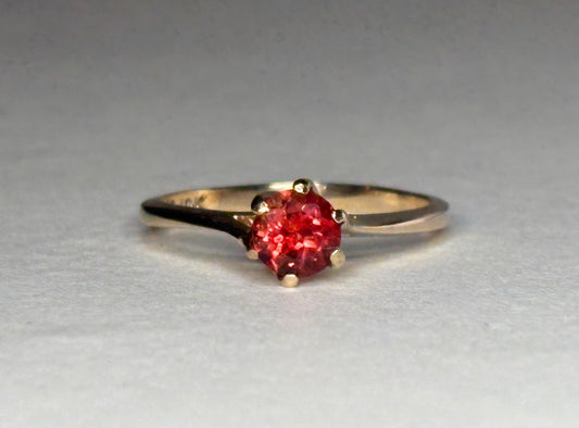 Red Oregon sunstone solitaire ring in 10k gold.