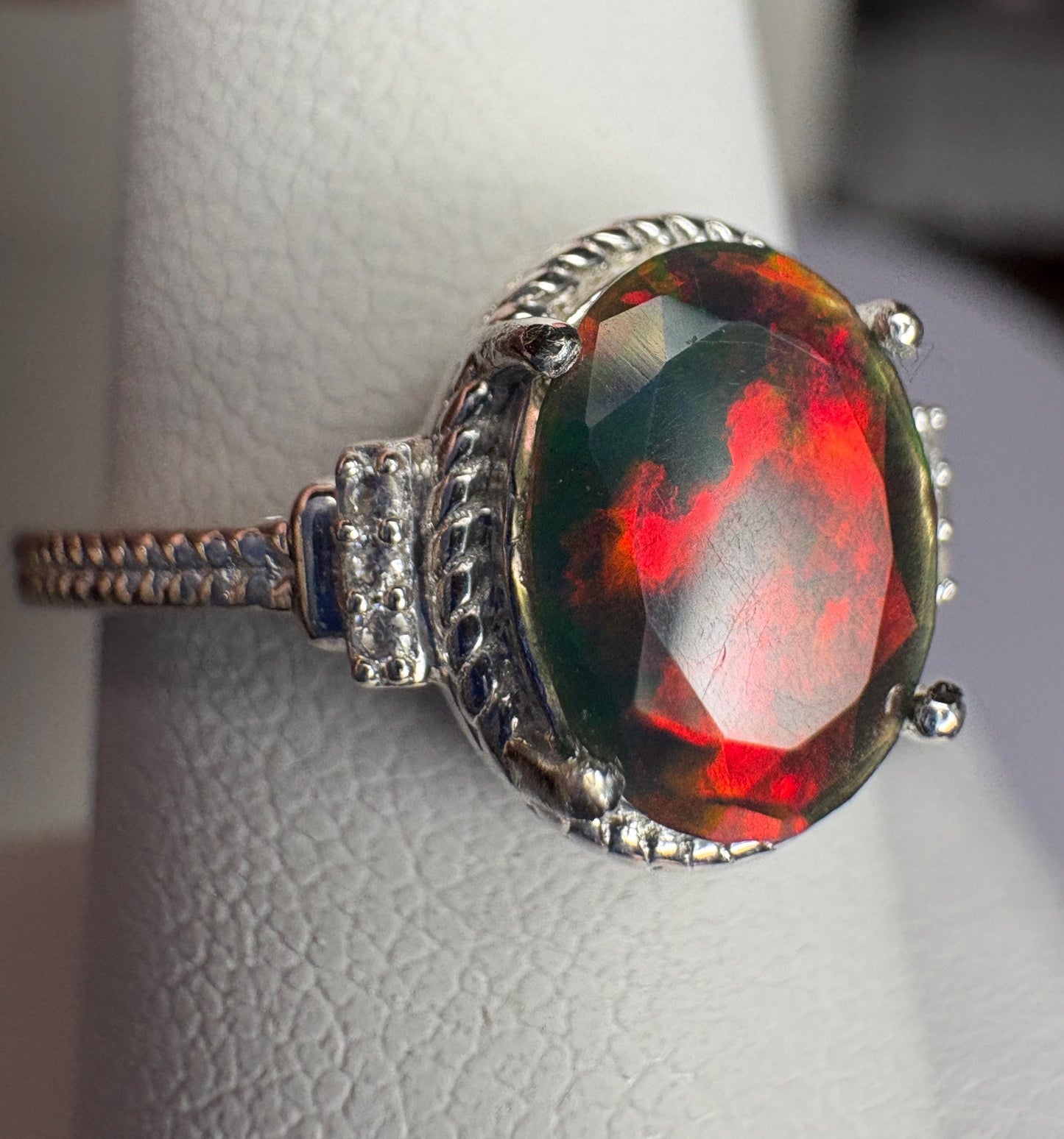 Sterling silver ring with an oval Ethiopian black opal and zircons.