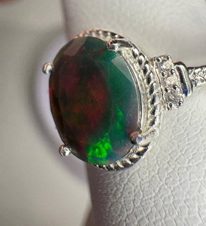 Ethiopian Wello black opal ring in sterling silver with red and green flashes.