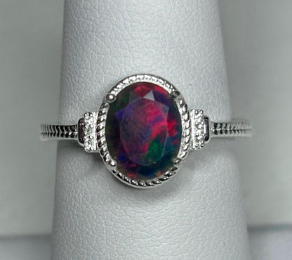 Oval Ethiopian black opal ring with red and green flashes in sterling silver.