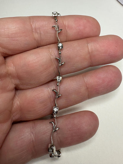 Solid 18k white gold bracelet with natural diamonds in a vine link design.