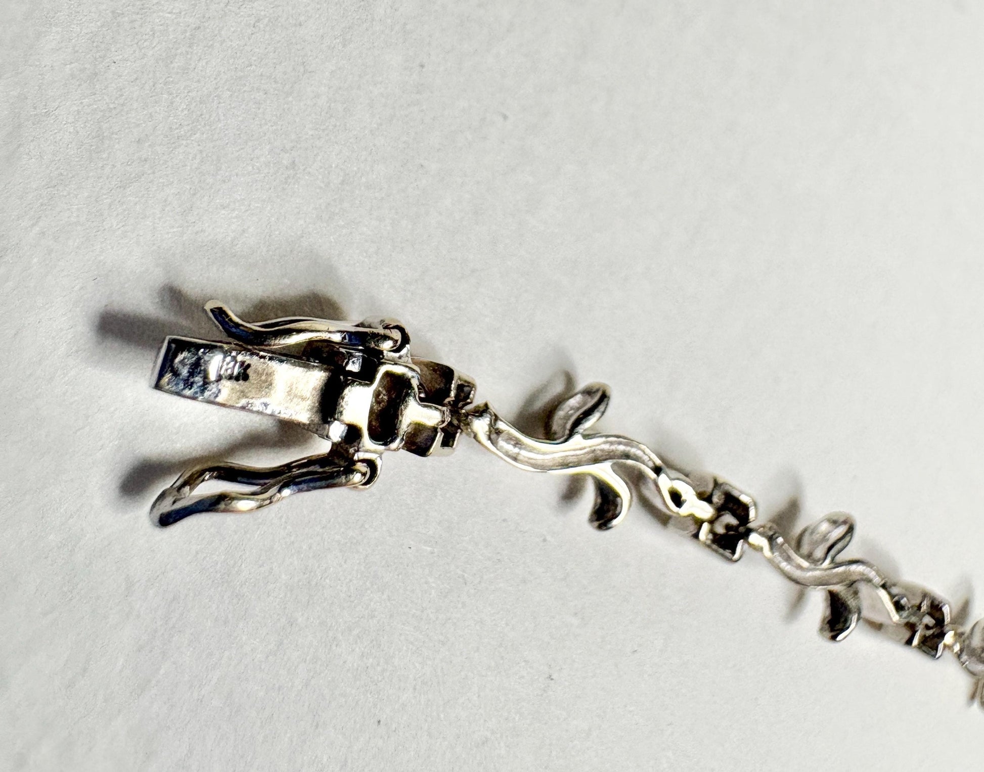 Solid 18k white gold vine link bracelet with diamonds.