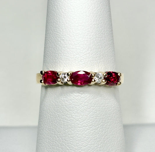14k gold band ring with oval rubies and diamonds.