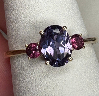 Color change synthetic sapphire and umbalite rhodolite garnet ring in 10k gold.