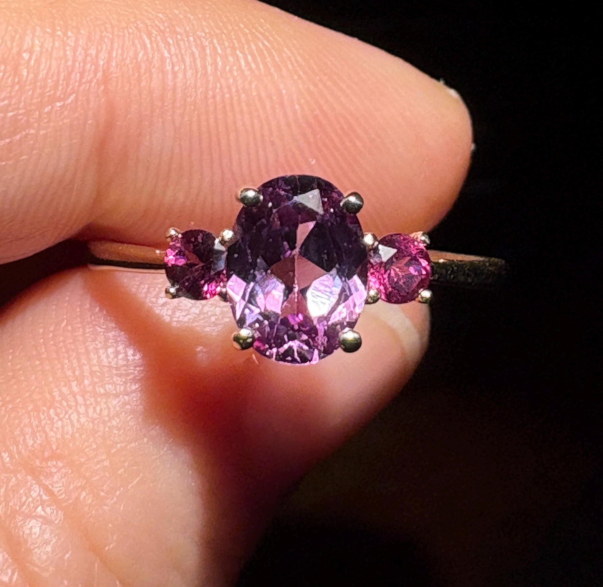 Color change synthetic sapphire and umbalite rhodolite garnet ring in 10k gold.