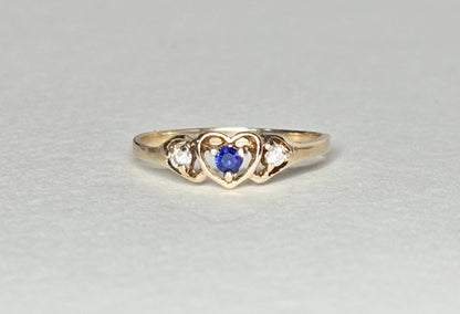 10k gold heart ring with blue sapphire and diamonds.