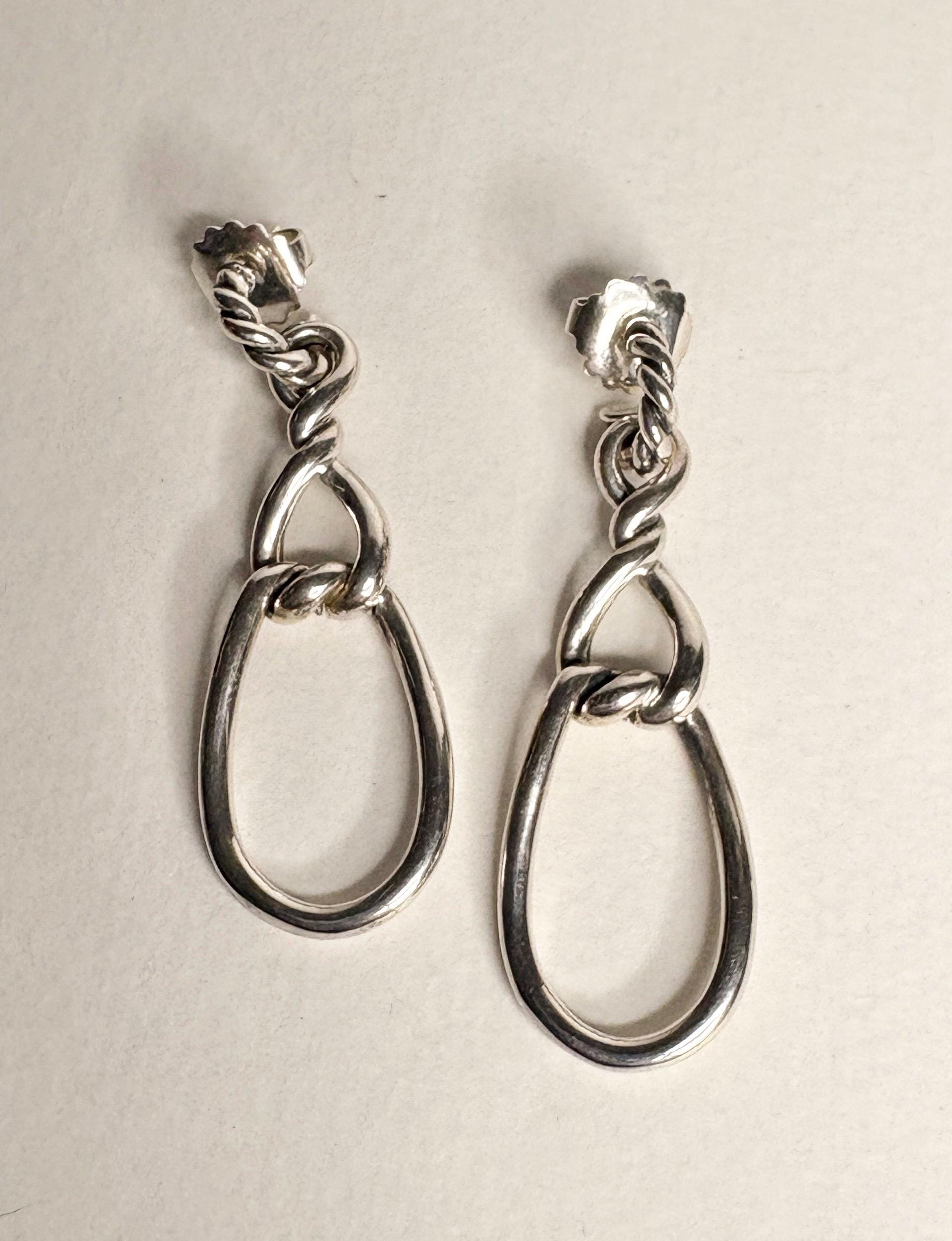 Sterling silver dangle earrings with twisted rope detail and 14k gold posts.