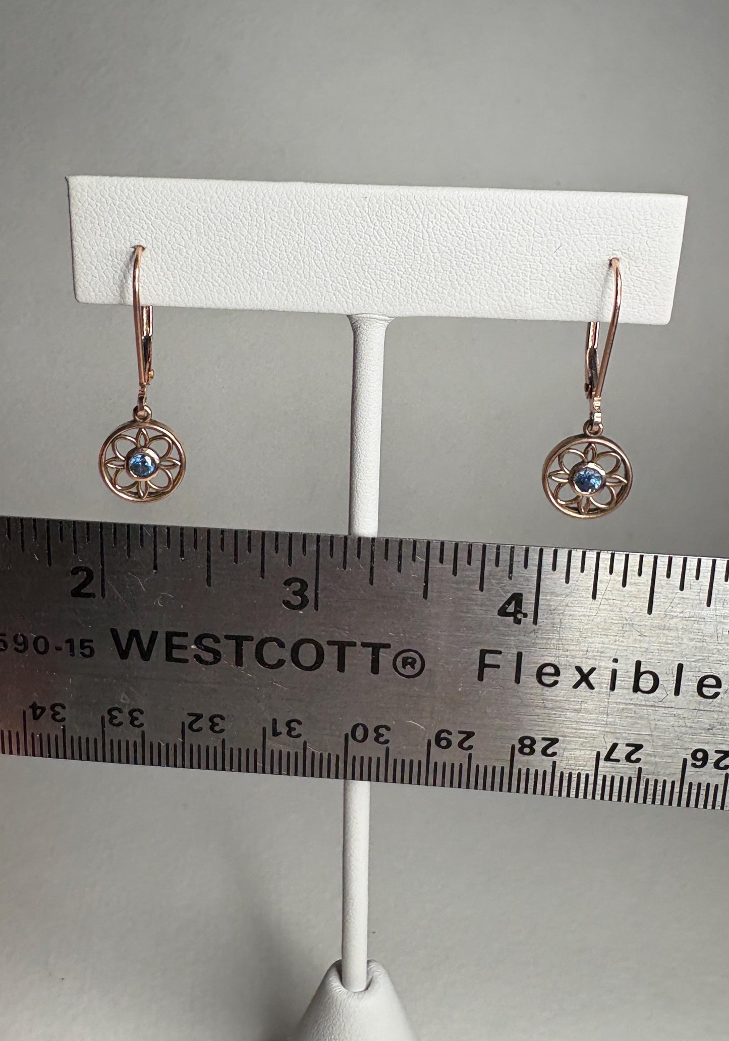 Montana sapphire dangle drop earrings in solid 14k rose gold with lever backs.