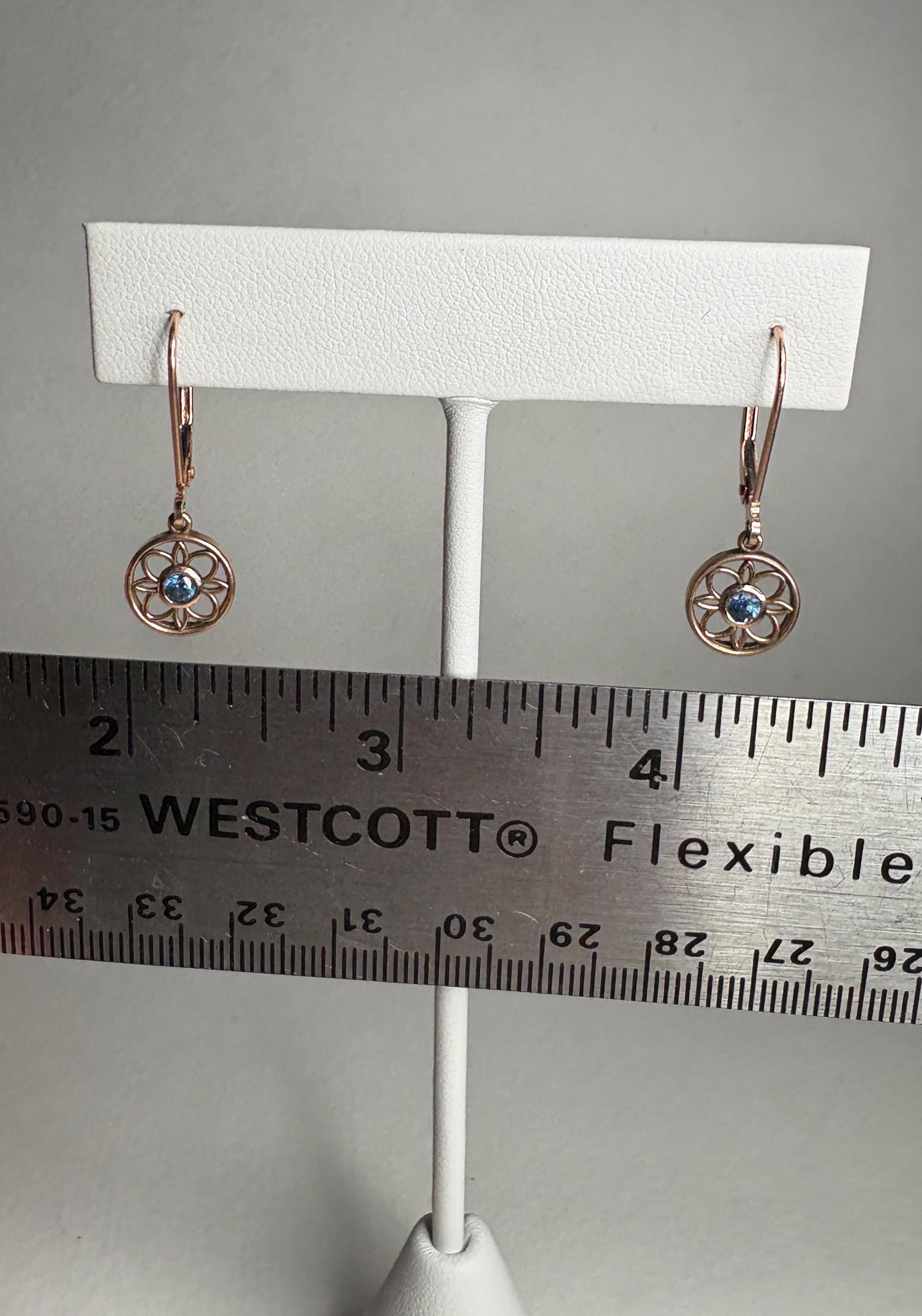 Montana sapphire dangle drop earrings in solid 14k rose gold with lever backs.