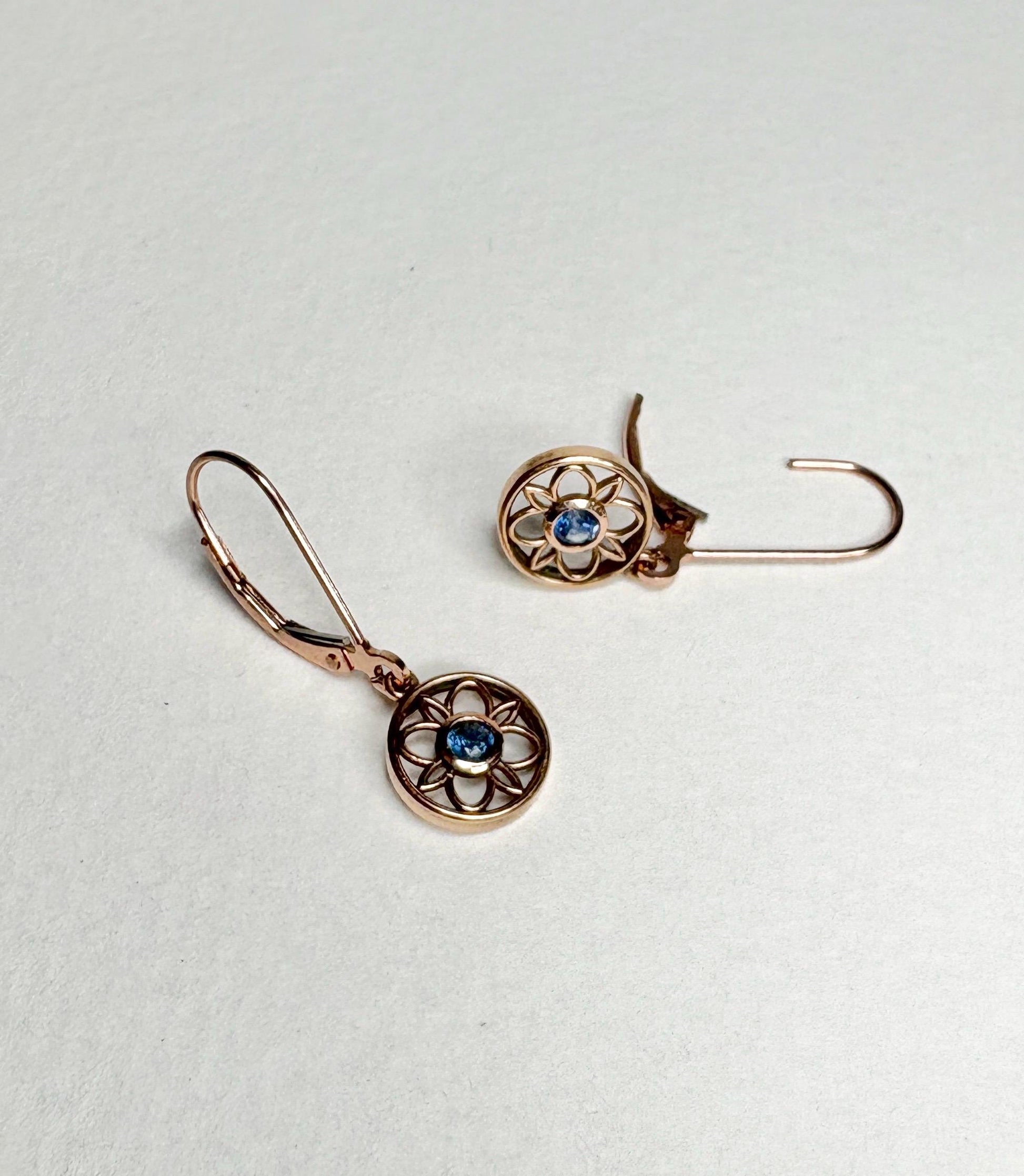 Montana sapphire dangle drop earrings in solid 14k rose gold with lever backs.