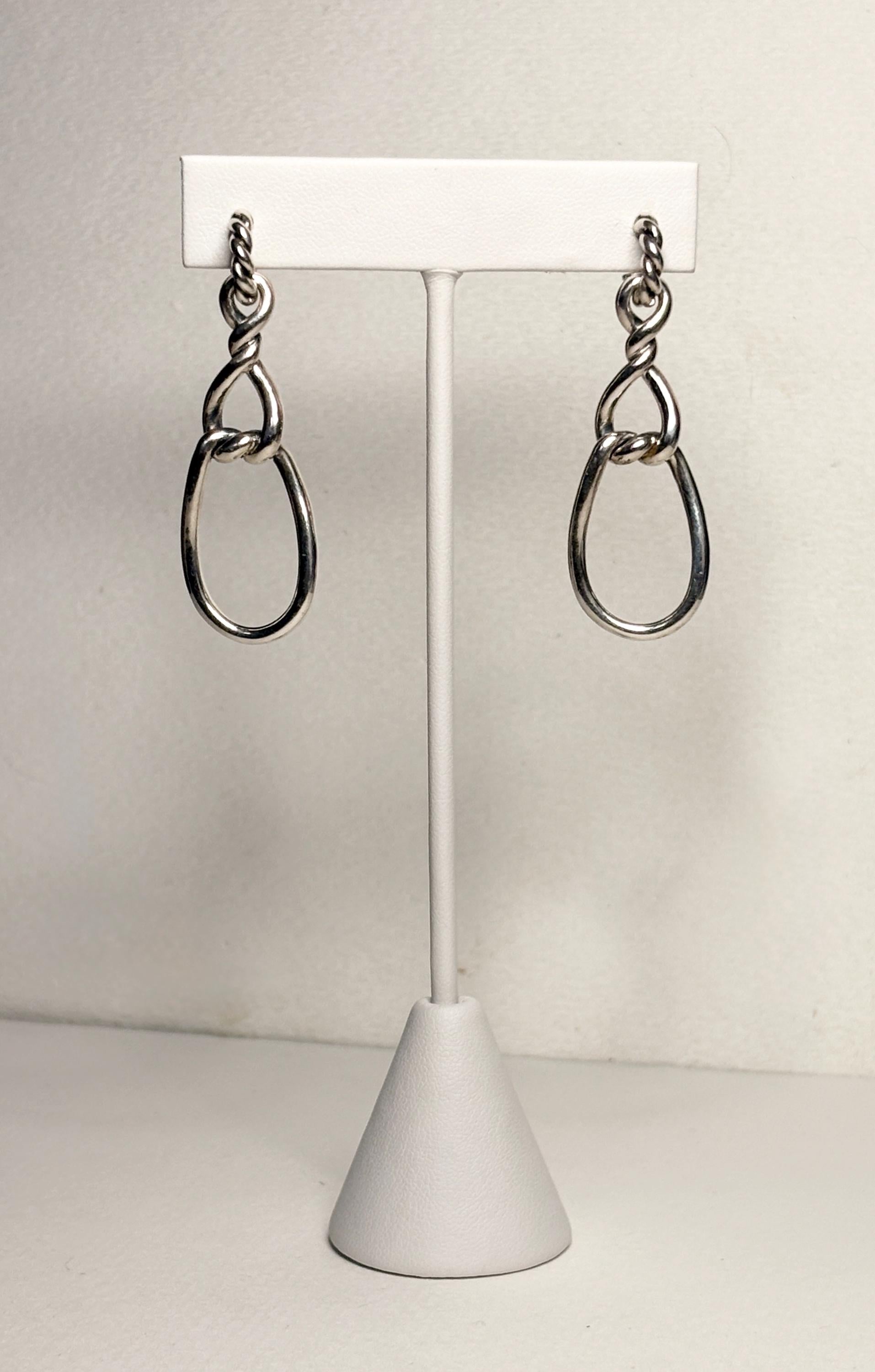 Sterling silver dangle earrings with twisted rope detail and gold posts.