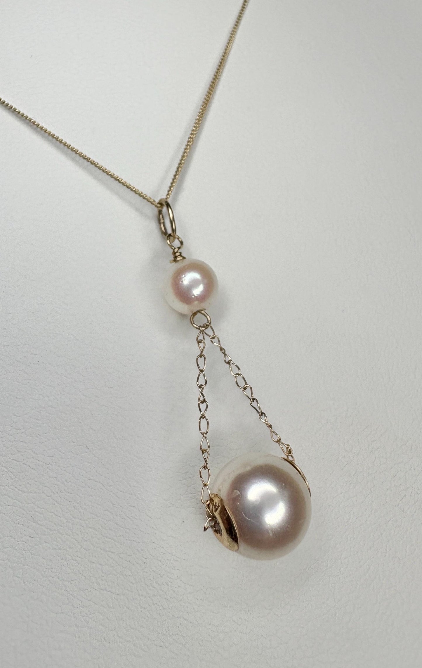 18k, 14k, and 9k gold lavaliere pendant necklace with two Akoya cultured pearls.