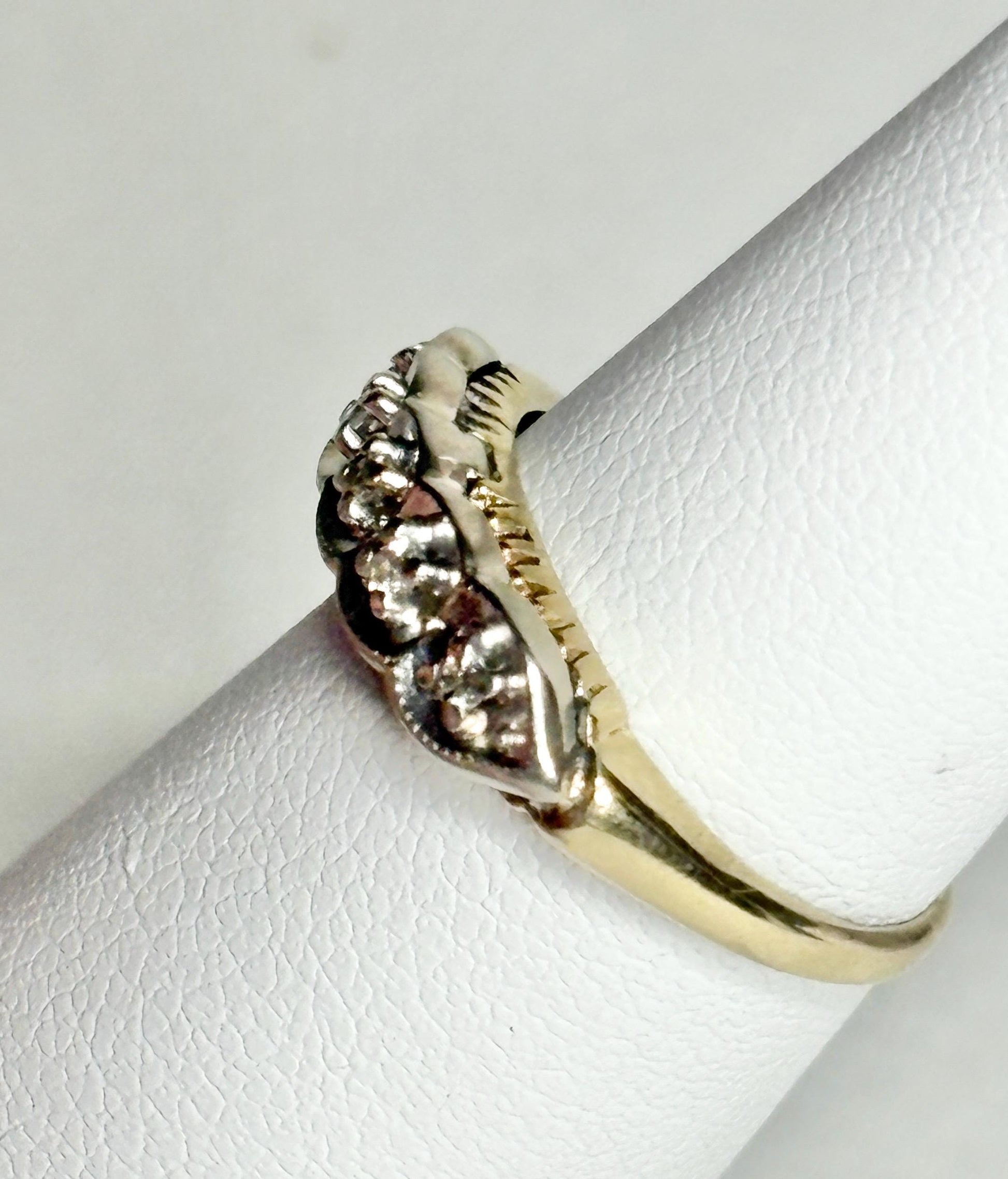 Vintage two-toned 10k gold band ring with small diamonds.