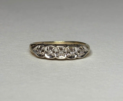 Vintage two-toned 10k gold band ring with five small diamonds.