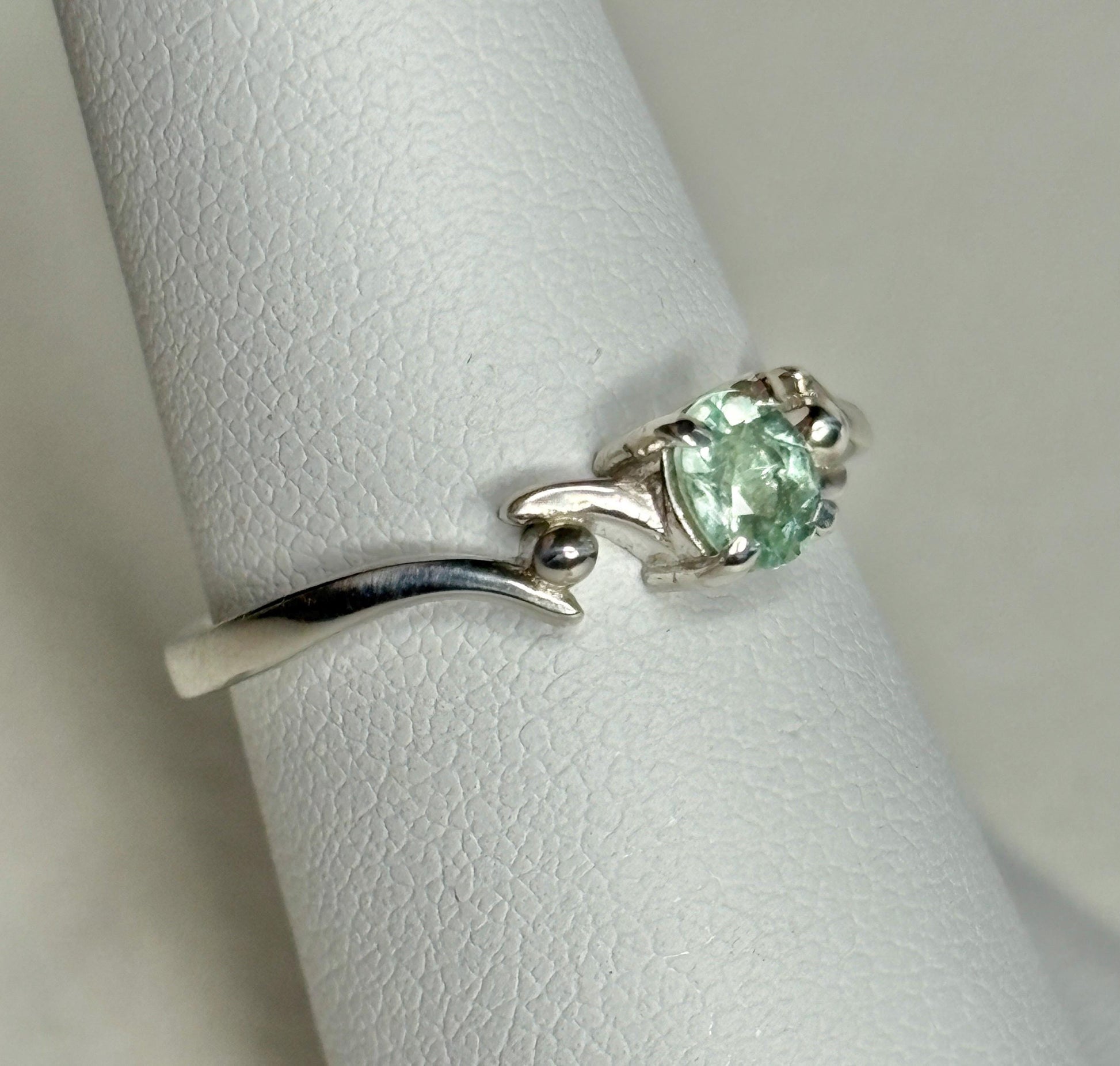 Sterling silver ring with a mint green oval tourmaline gemstone.