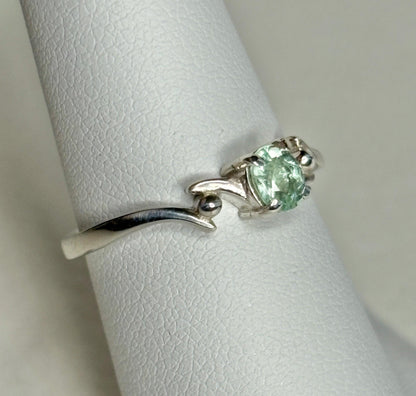 Sterling silver ring with a mint green oval tourmaline gemstone.