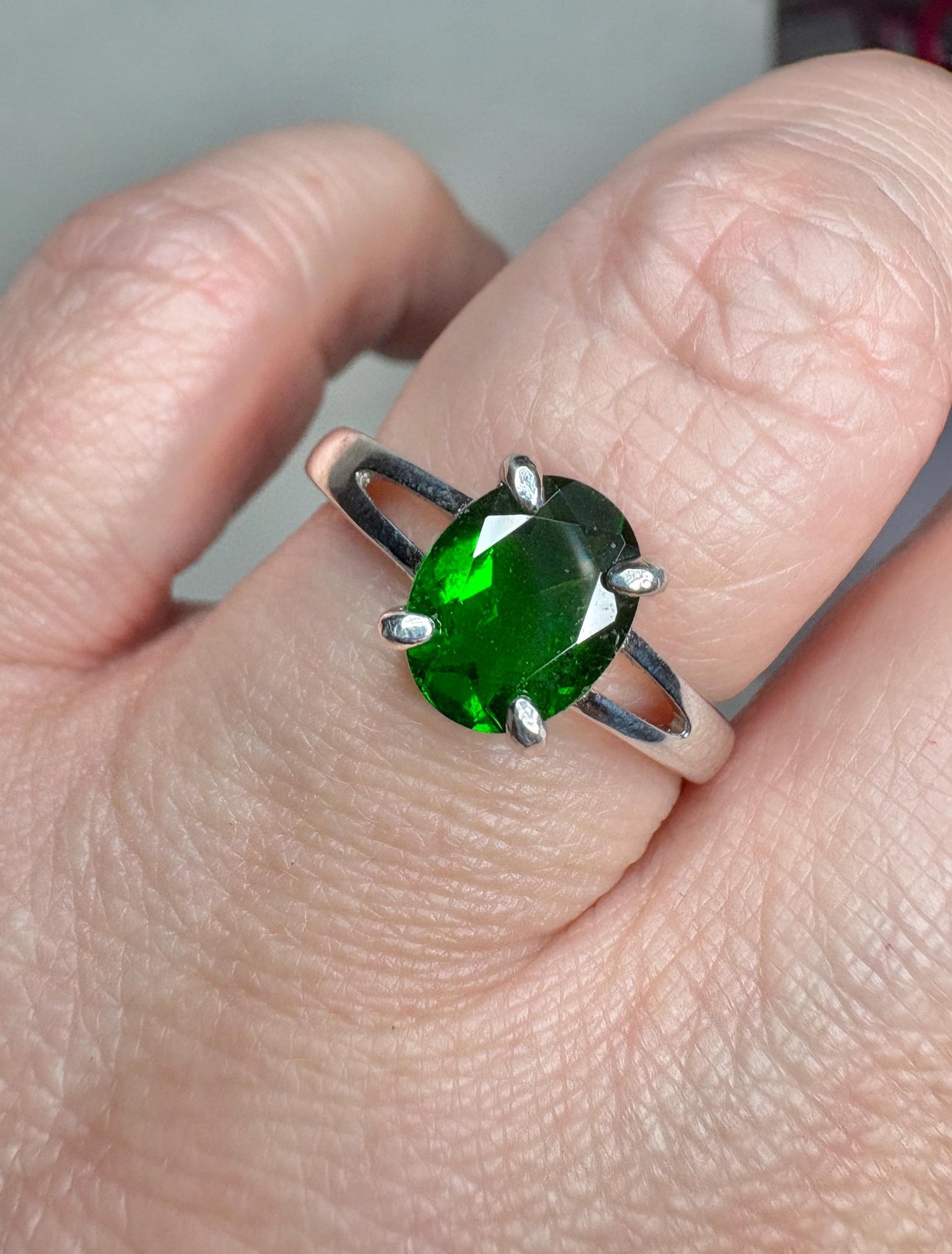 Sterling silver ring with an oval chrome diopside gemstone.